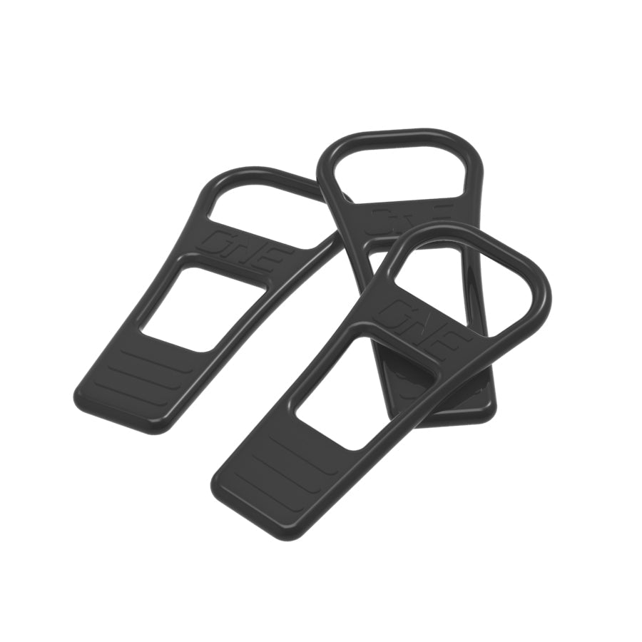 Three black OneUp EDC pump retaining straps