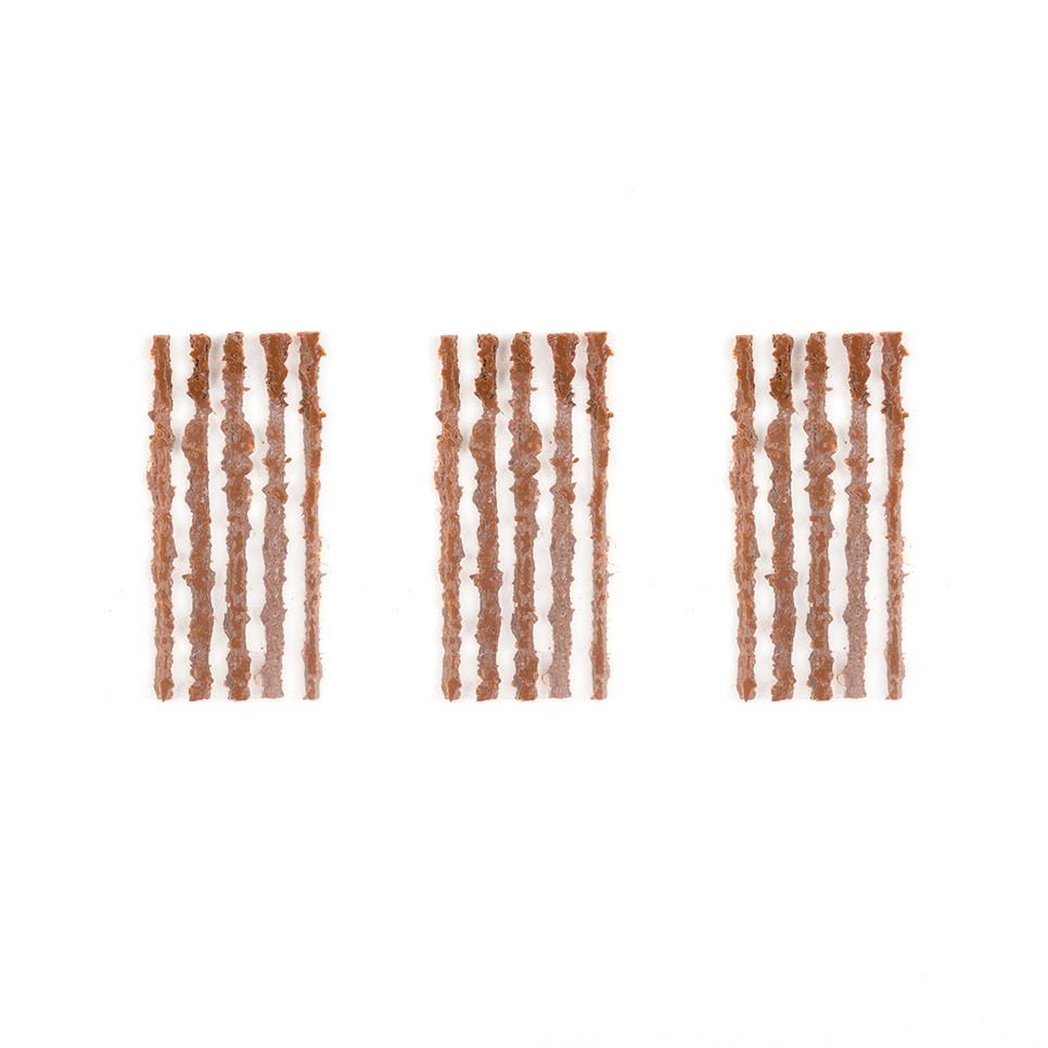 OneUp EDC tyre-repair strips arranged in three groups