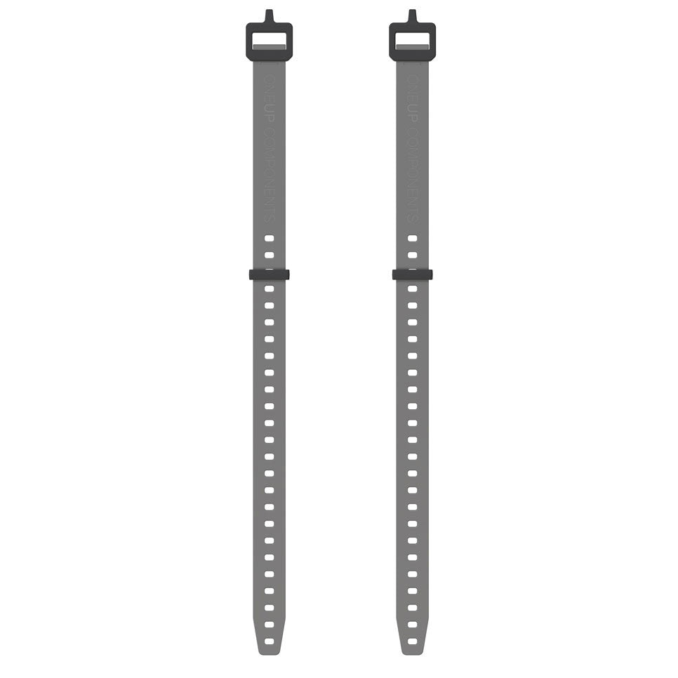 Two grey OneUp EDC gear straps
