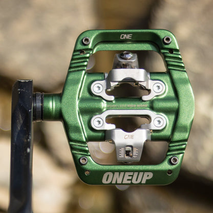 Dark green OneUp Clip pedal installed on a crank