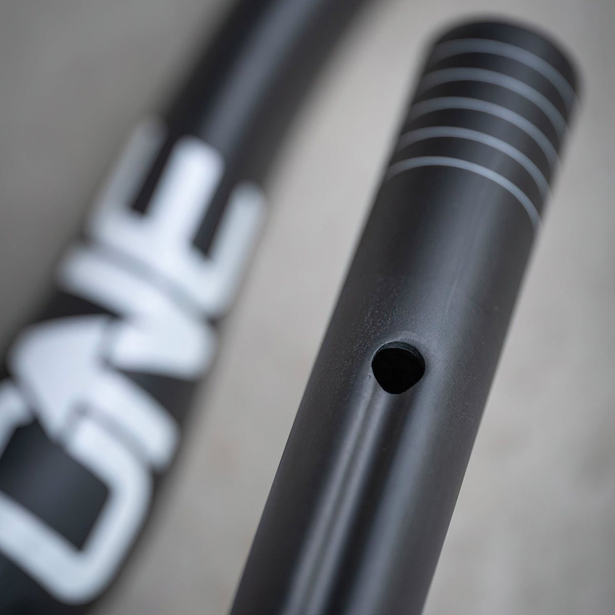 Close-up of a cable port in the OneUp Carbon E-Bar