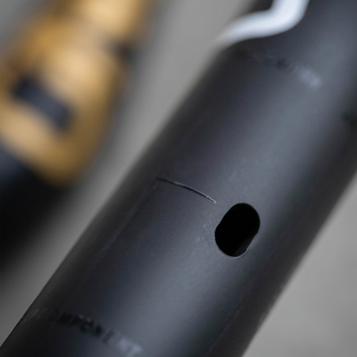 Close-up of the OneUp Carbon E-Bar cable opening