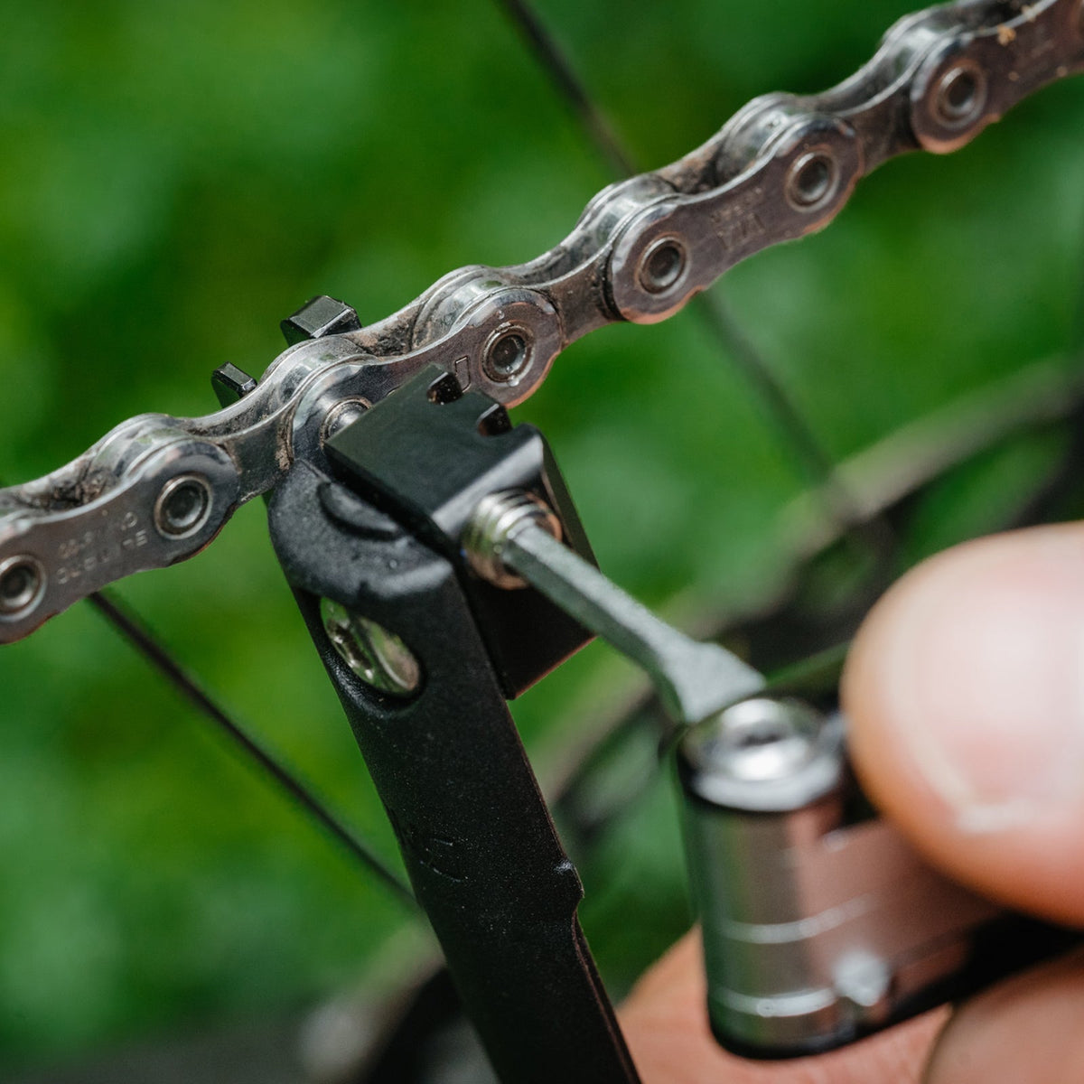 OneUp EDC V2 chain breaker working on a chain