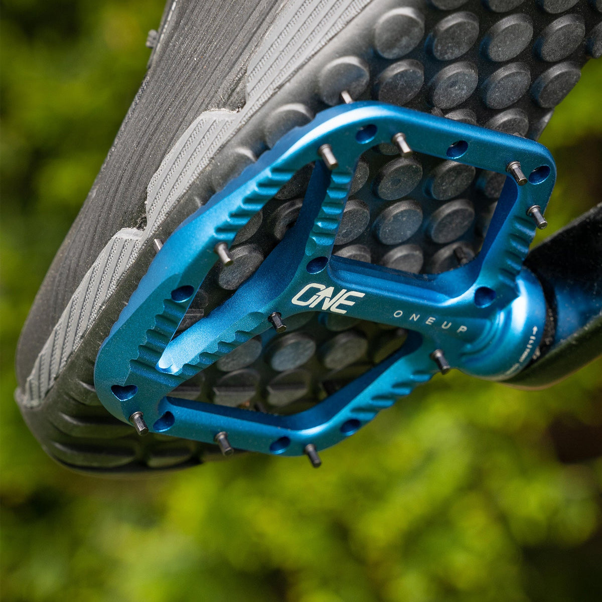 OneUp Aluminium Pedal supporting a mountain-bike shoe