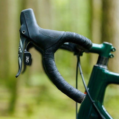 OneUp Drop Bar Paddle Remote fitted inside a SRAM hood outdoors