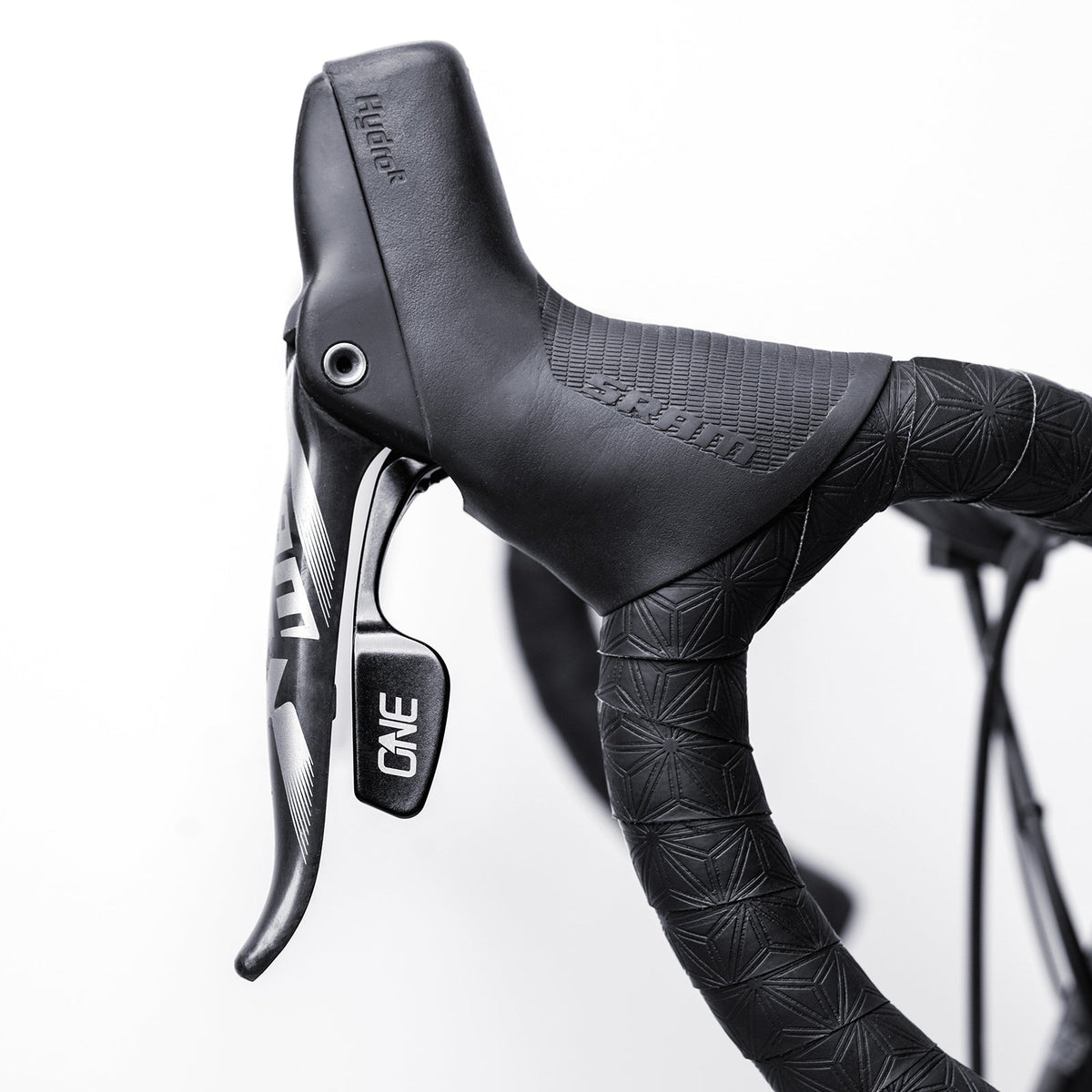 OneUp paddle installed beside a SRAM brake lever