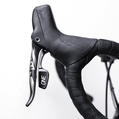 OneUp paddle installed beside a SRAM brake lever