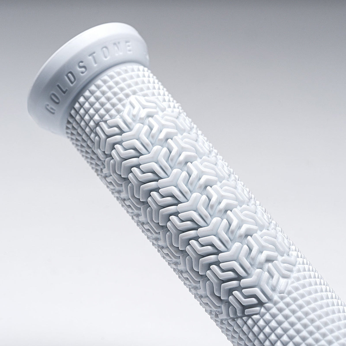 Close-up of the raised palm texture and flange on a white Goldstone Grip