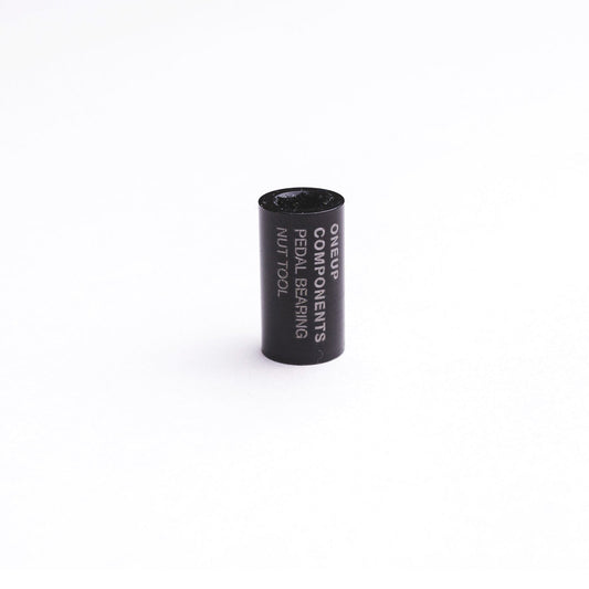 Black OneUp pedal bearing-nut tool