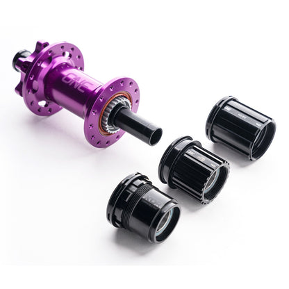 OneUp Rear Hub beside separately sold freehub options