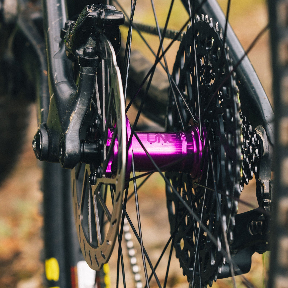 Purple OneUp Rear Hub installed with cassette and brake rotor