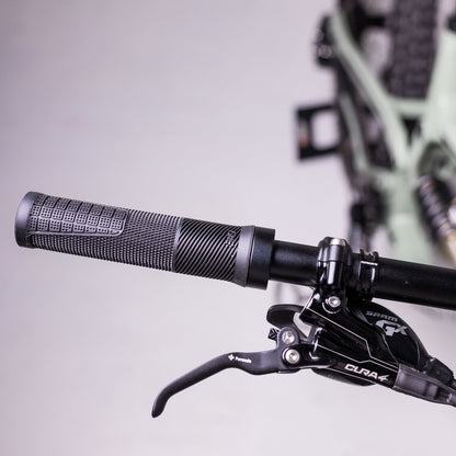 Black OneUp Thin Grip fitted to a handlebar