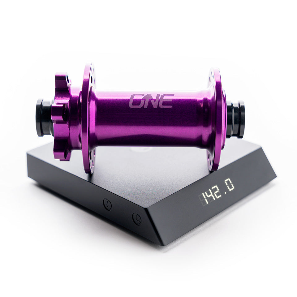 OneUp Front Hub on a scale showing 142g
