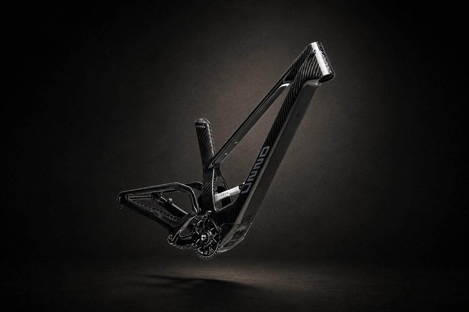 Carbon fiber Unno E-bike frame with a DJI Avinox M2S Motor on a dark background. Sold exclusively at www.brink.uk