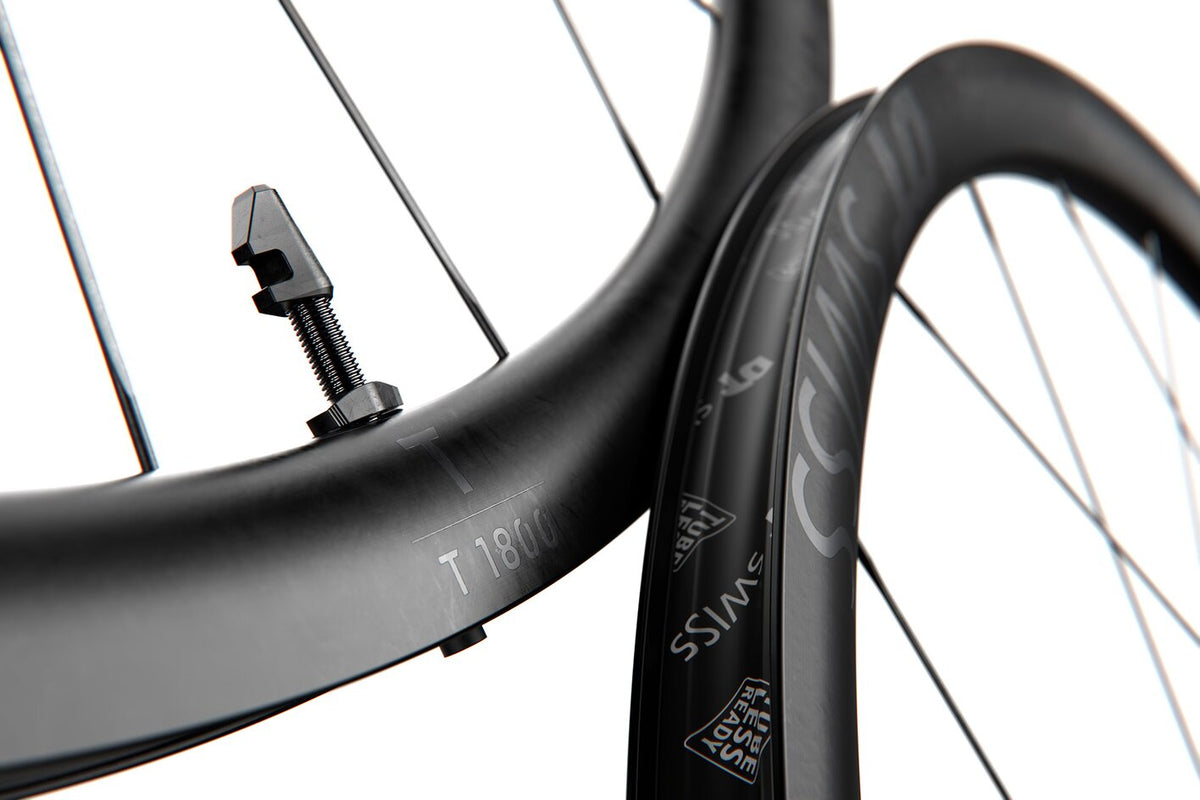 DT Swiss T 1800 Classic Clincher Wheels - T1800 rim pair detail on white, readable T1800 label and shallow profile; landscape image without the square padding in C126.