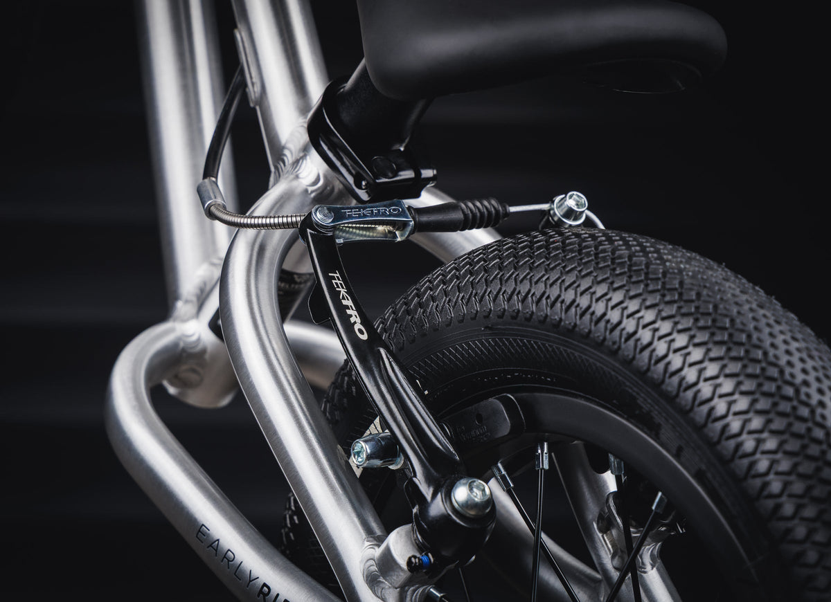 Early Rider Belter 12 Balance Bike in Brushed Aluminium - Vee Speedster rear tyre tread with rim brake visible