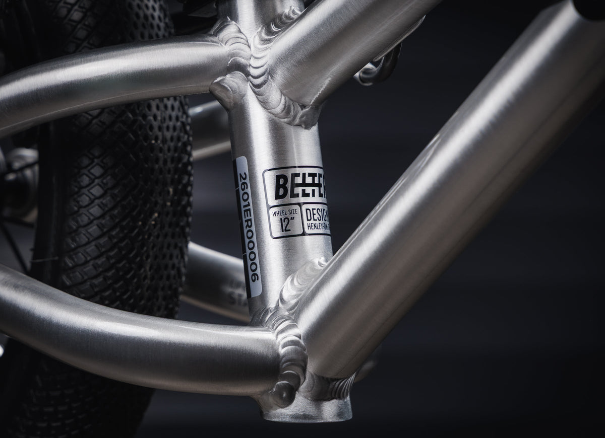 Early Rider Belter 12 Balance Bike in Brushed Aluminium - low frame junction and Belter 12 model badge