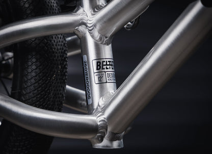 Early Rider Belter 12 Balance Bike in Brushed Aluminium - low frame junction and Belter 12 model badge
