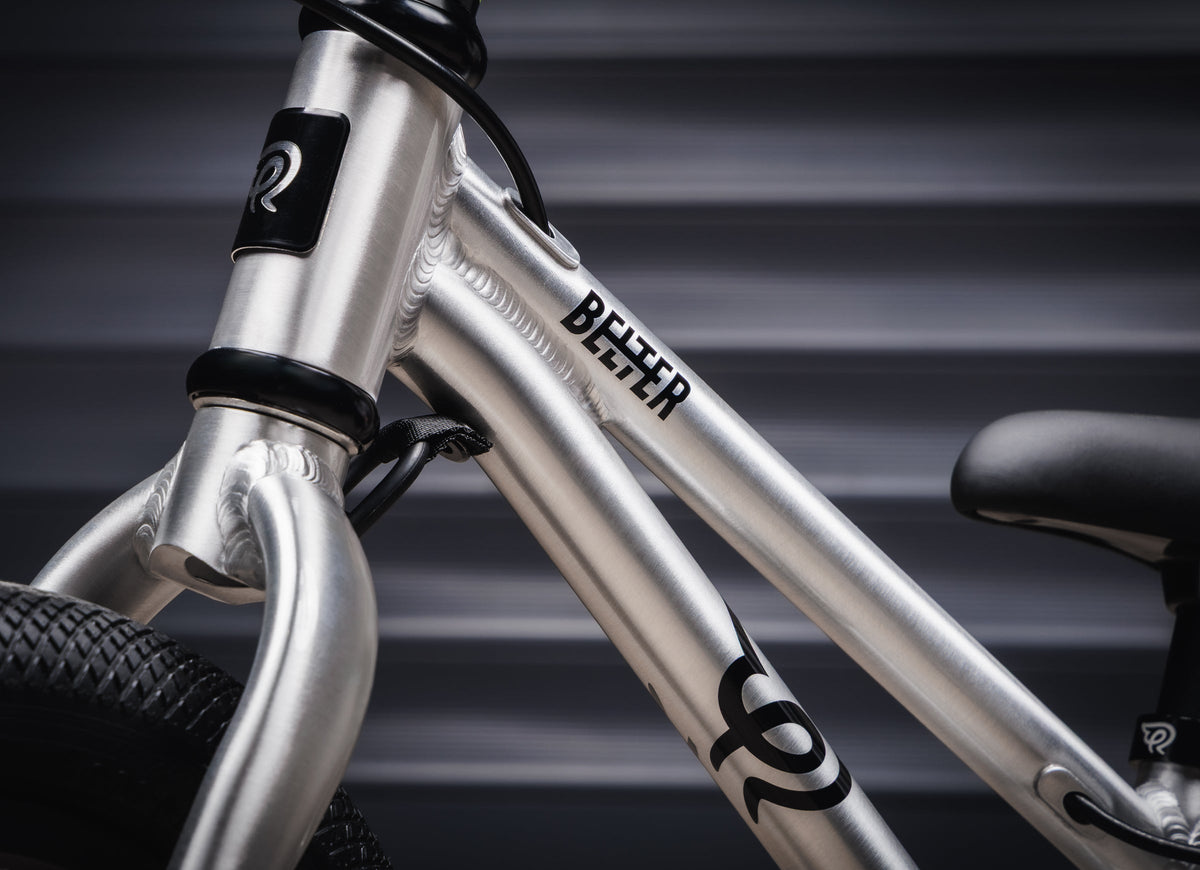 Early Rider Belter 12 Balance Bike in Brushed Aluminium - Belter frame marking and rigid fork crown