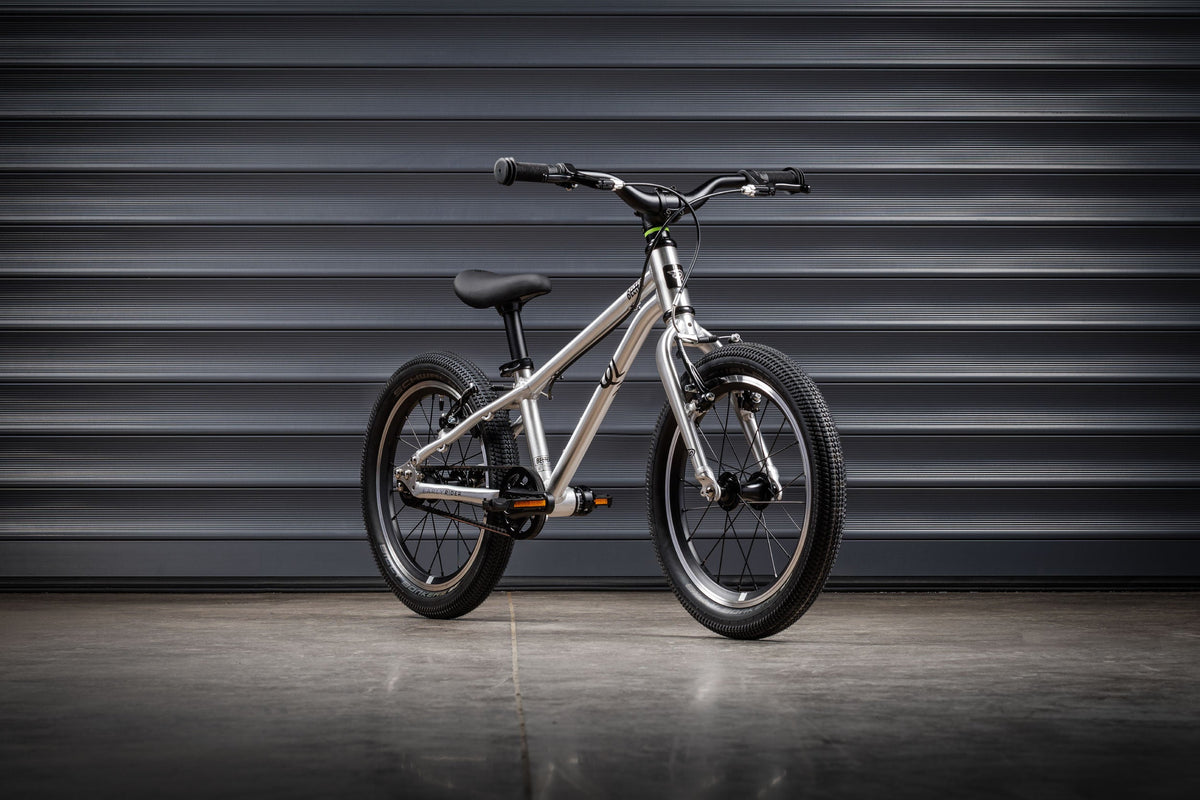 Early Rider Belter 16 in Brushed Aluminium against grey shutters