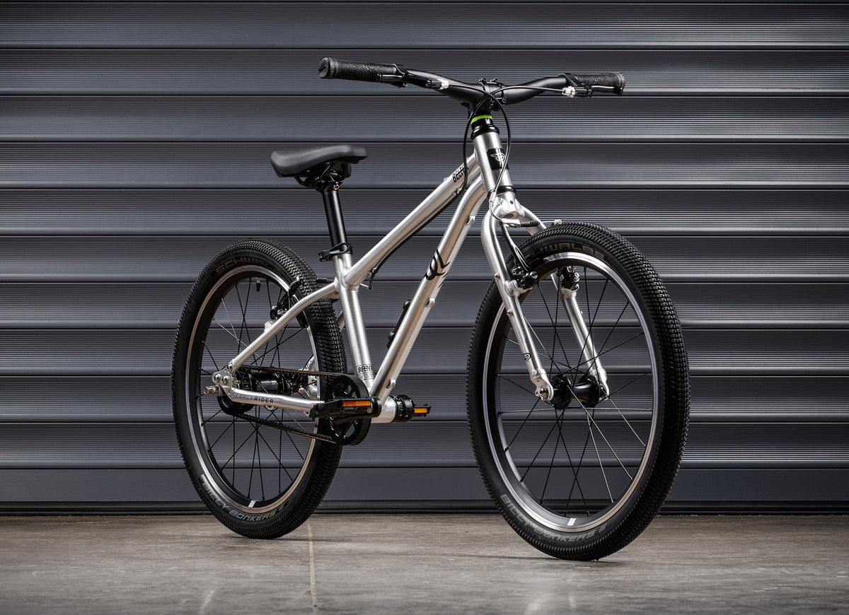 Early Rider Belter 20 Auto in Brushed Aluminium - Auto whole bike against shutters