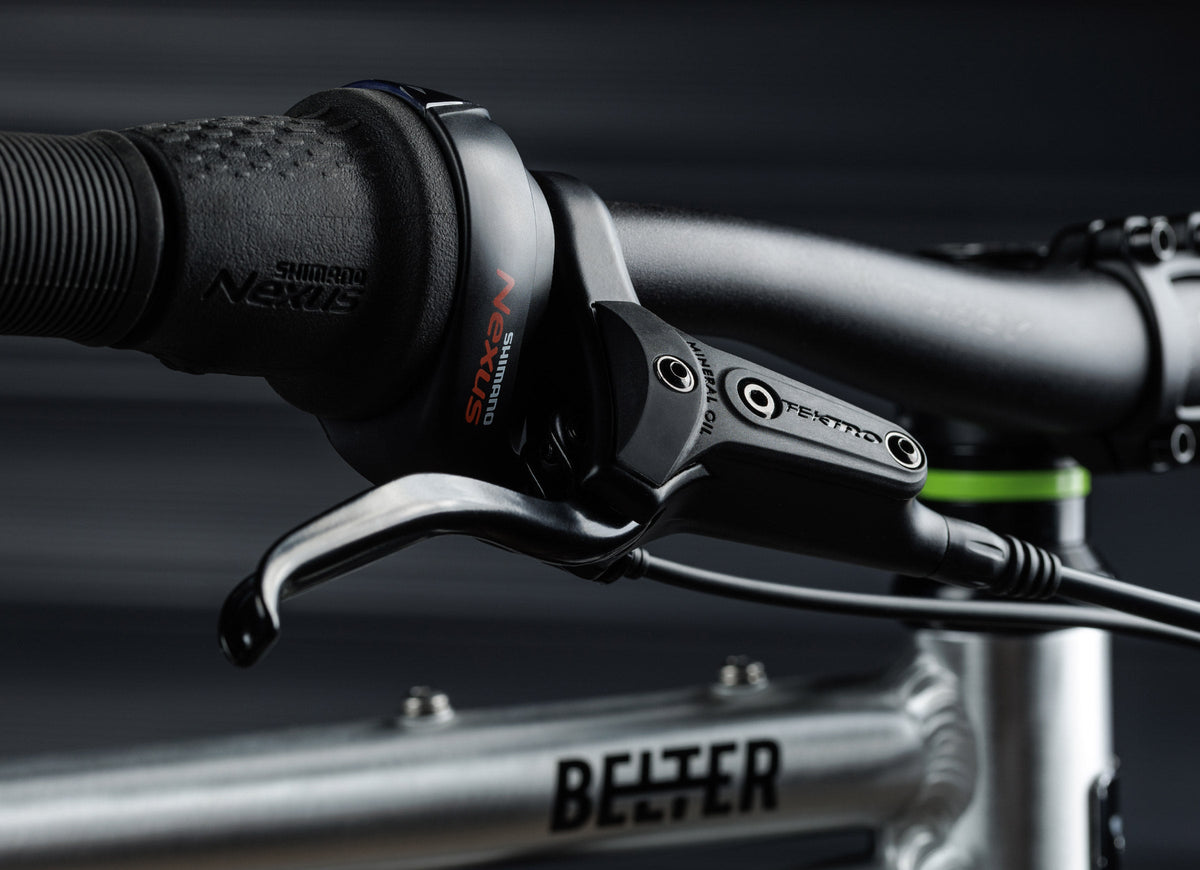 Early Rider Belter 24 in Brushed Aluminium - Nexus shifter and brake lever side view