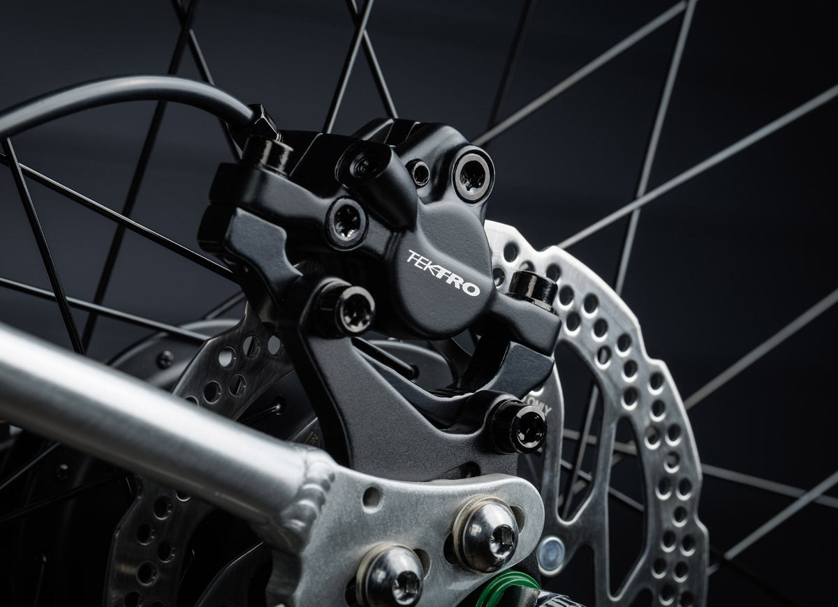Early Rider Belter 24 in Brushed Aluminium - rear Tektro disc brake caliper and rotor