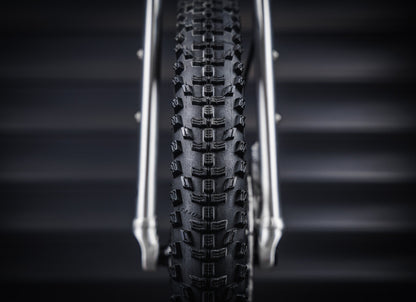 Early Rider Seeker 14 in Brushed Aluminium - front Kenda Booster tread between rigid fork legs