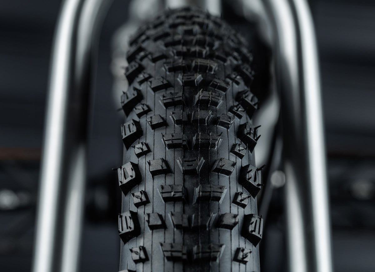 Early Rider Seeker 16 in Brushed Aluminium - Kenda Booster tread detail