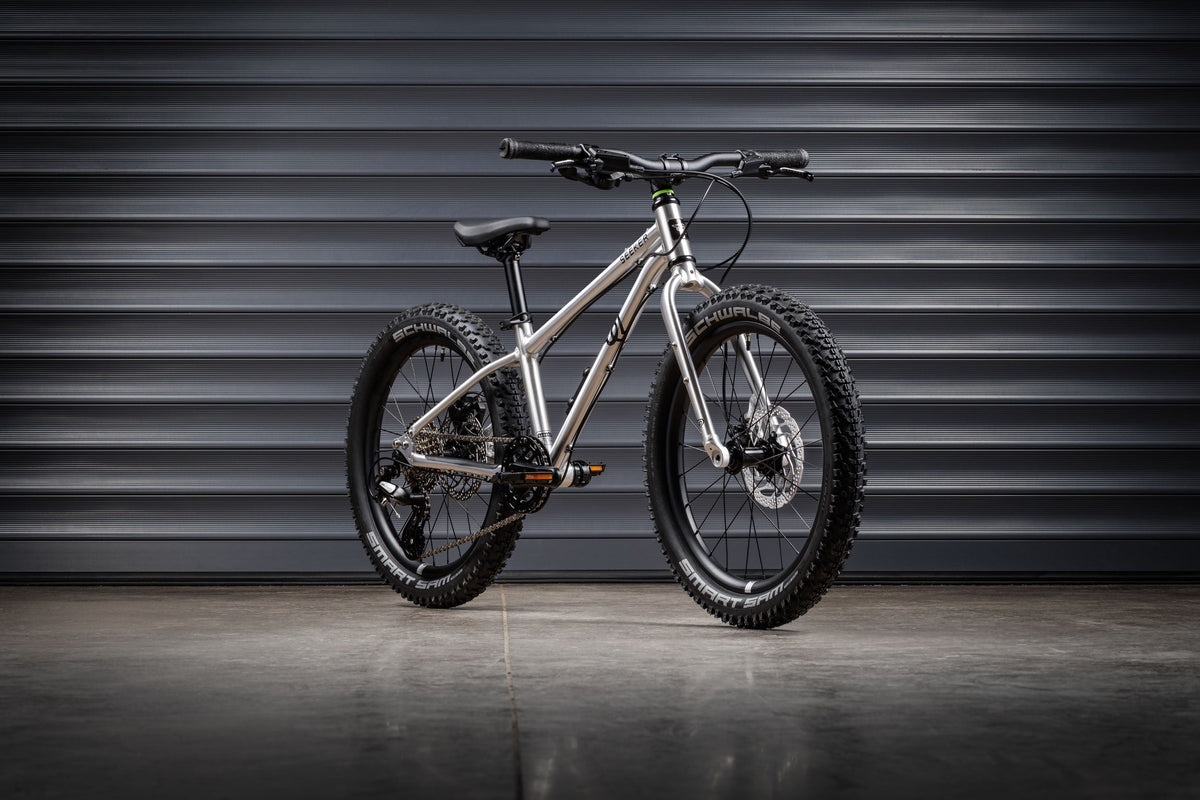 Early Rider Seeker 20 in Brushed Aluminium against grey shutters