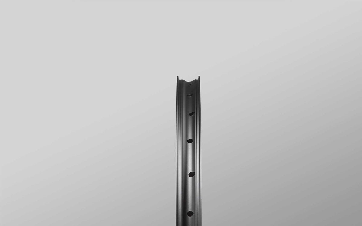 Asymmetric spoke-hole layout in a Reserve aluminium rim