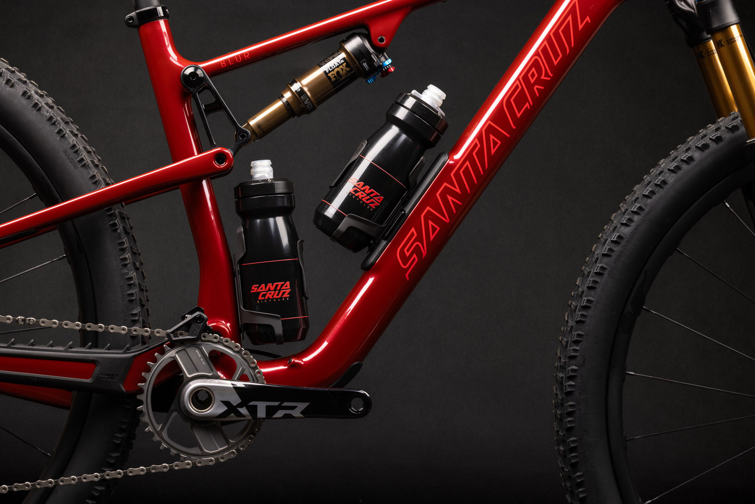Santa Cruz Blur 5 with two full-size bottles