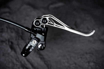 Trickstuff Piccola HD Titanium lever and black pump showing the angled hose fitting.