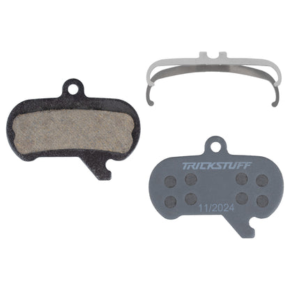 Trickstuff Standard 870 brake pads, showing friction and backing faces with a retaining spring.